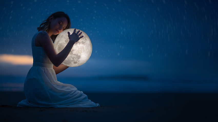 woman-sleep-at-night-holding-moon