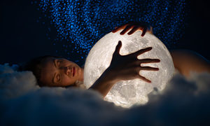 woman restfully sleeping on a cloud hugging an illuminated moon under a starry background