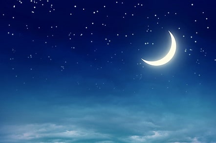 sleepy night crescent moon with stars over low clouds