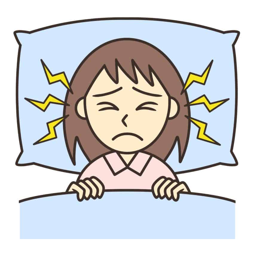 A young woman suffering from sleeplessness due to tinnitus